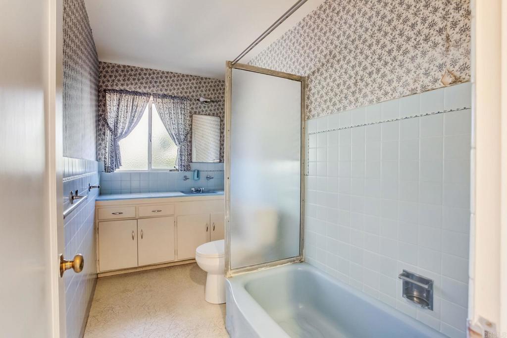 45 Springer Road Los Altos, CA 94024 - Photo 24 of 33 a spacious bathroom with a granite countertop sink and a bathtub