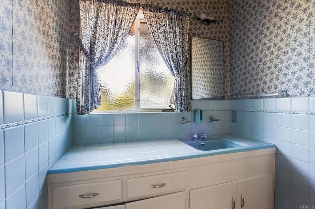 45 Springer Road Los Altos, CA 94024 - Photo 25 of 33 a bathroom with a sink and mirror