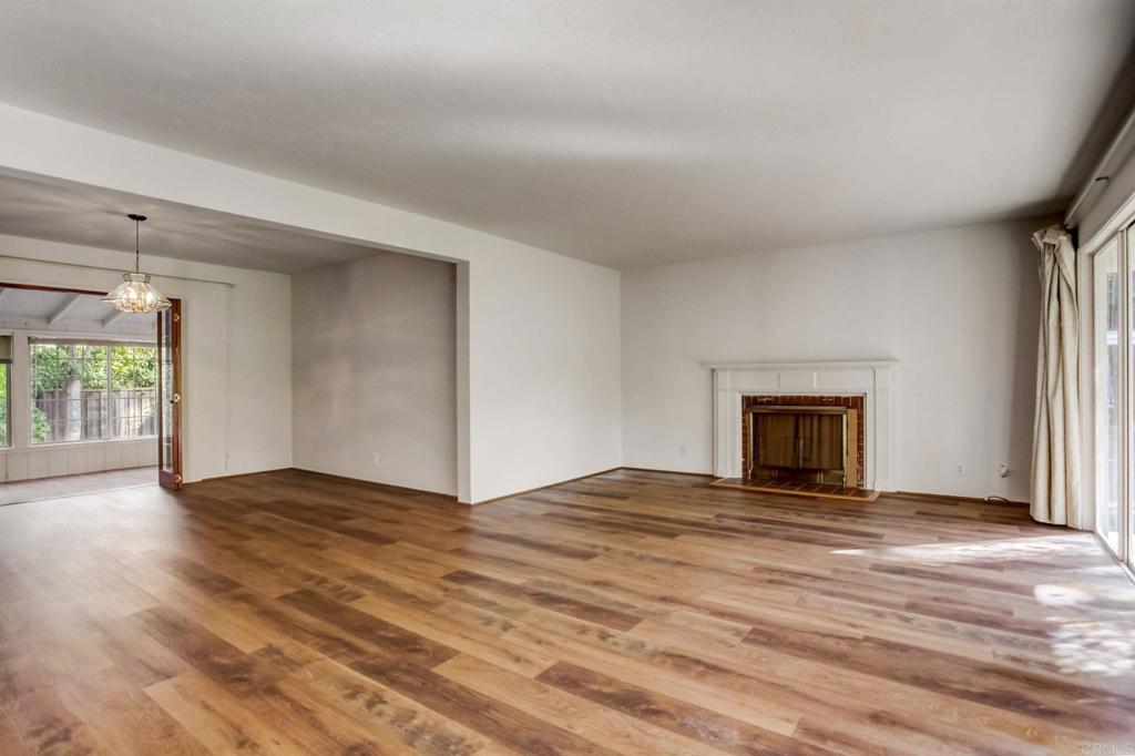 45 Springer Road Los Altos, CA 94024 - Photo 9 of 33 a view of empty room with wooden floor and fireplace