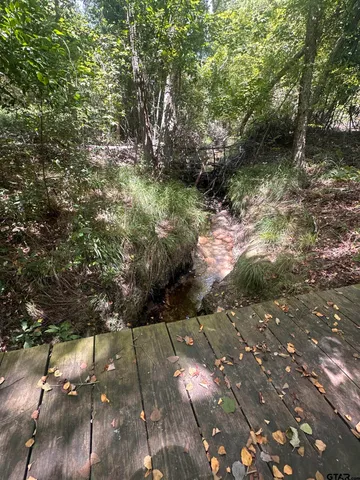 a view of outdoor space with playground and green space