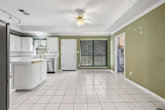 a kitchen with a stove a sink and a refrigerator