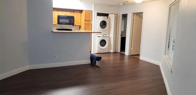 a view of a entryway with wooden floor