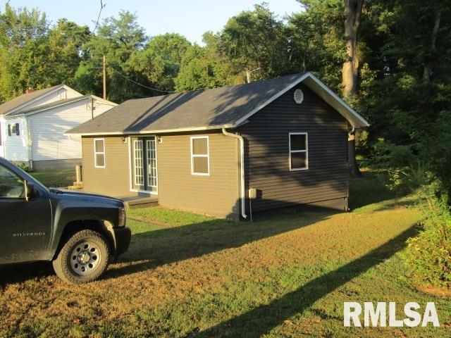 1506 Hillside Road Rosiclare, IL 62982 - Photo 19 of 29 a front view of a house with garden
