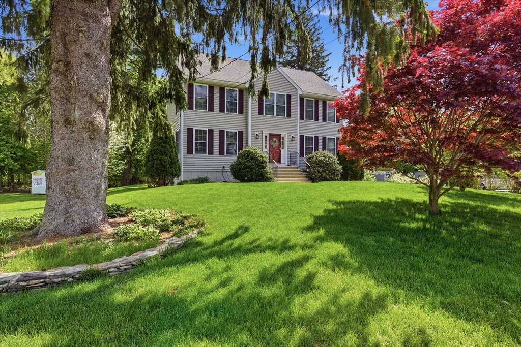3 Wing Road Wilmington, MA 01887 - Photo 2 of 36 a front view of a house with yard and green space