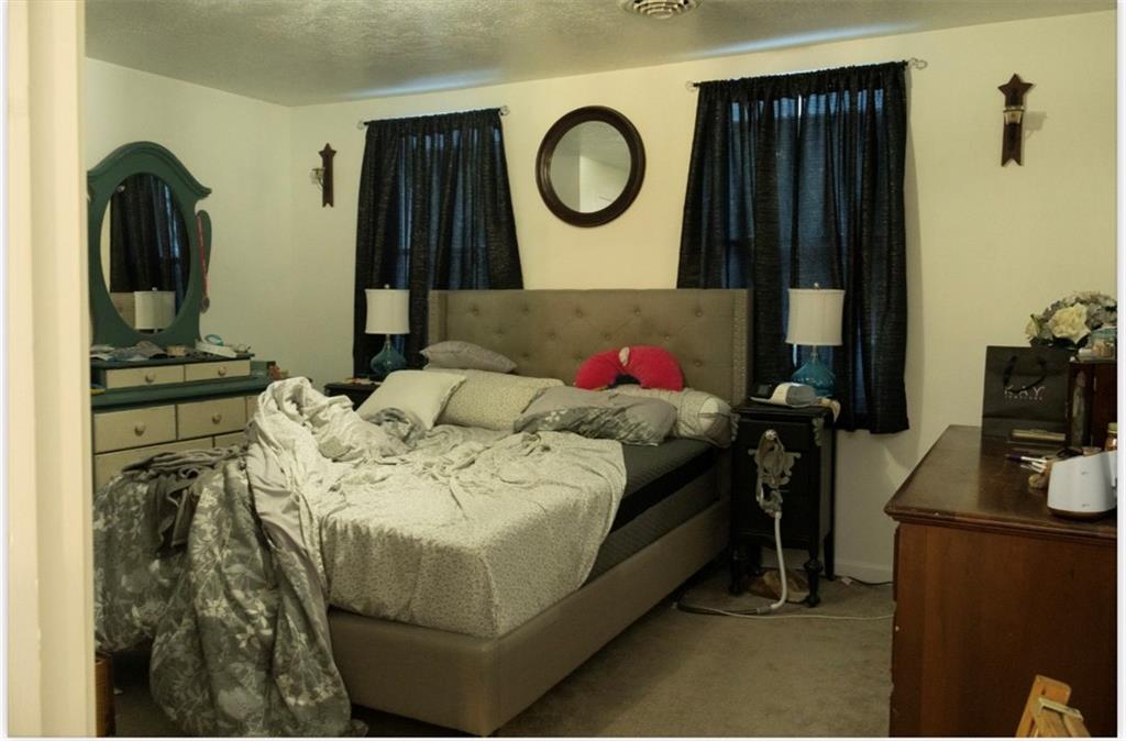 204 Pine Hill Road Kittanning, PA 16201 - Photo 15 of 23 a bed sitting in a bedroom next to a window and dresser