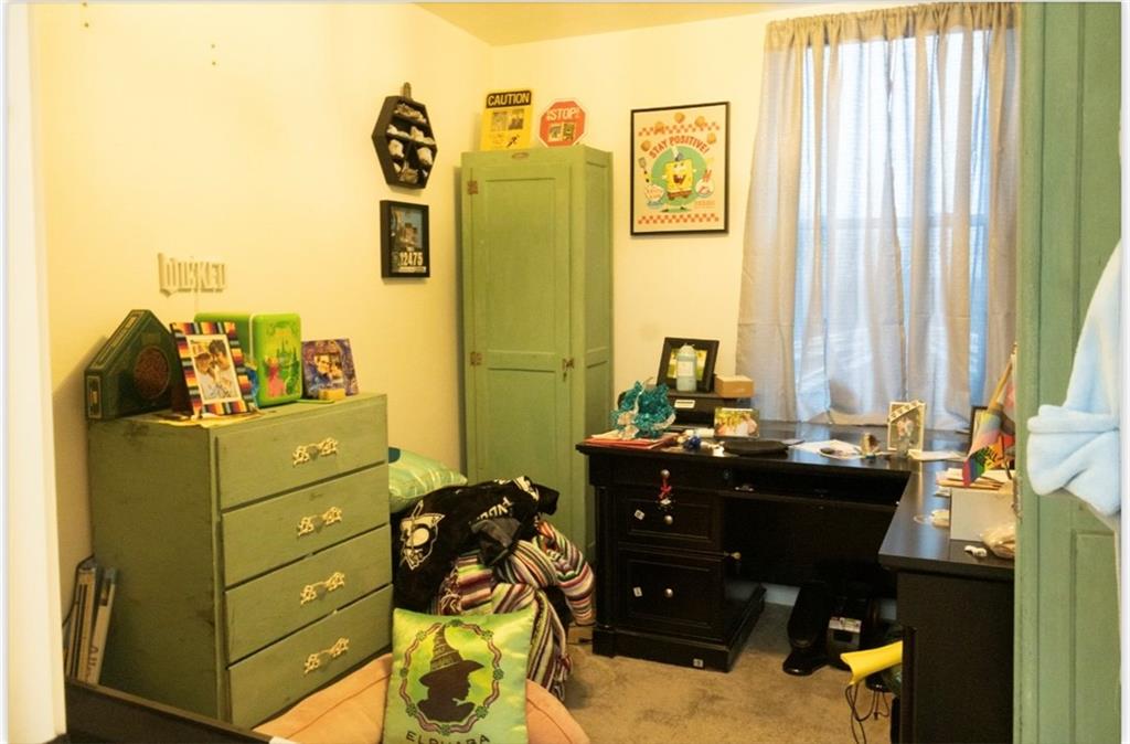 204 Pine Hill Road Kittanning, PA 16201 - Photo 18 of 23 a room with a chair and large windows