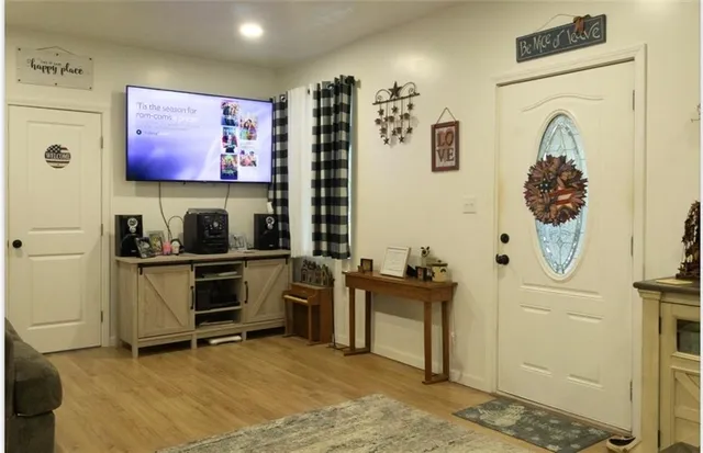 a view of a livingroom with workspace and a window