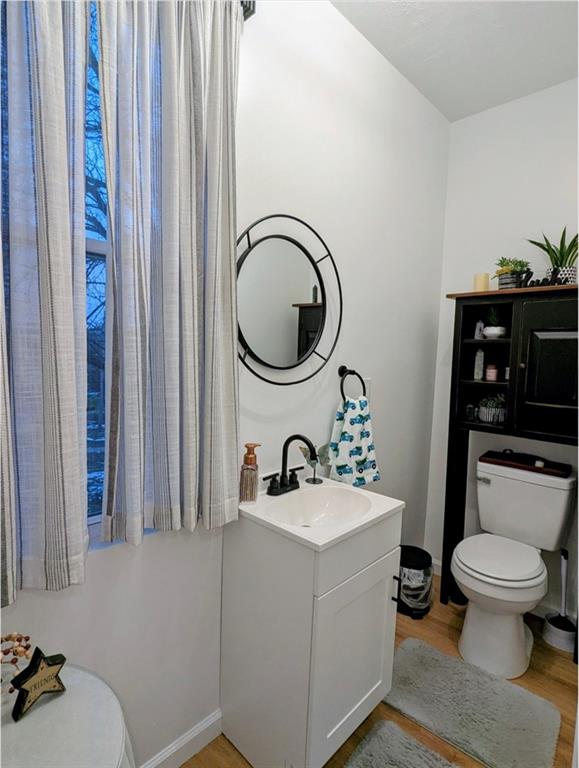 204 Pine Hill Road Kittanning, PA 16201 - Photo 7 of 23 a bathroom with a toilet a sink and a mirror