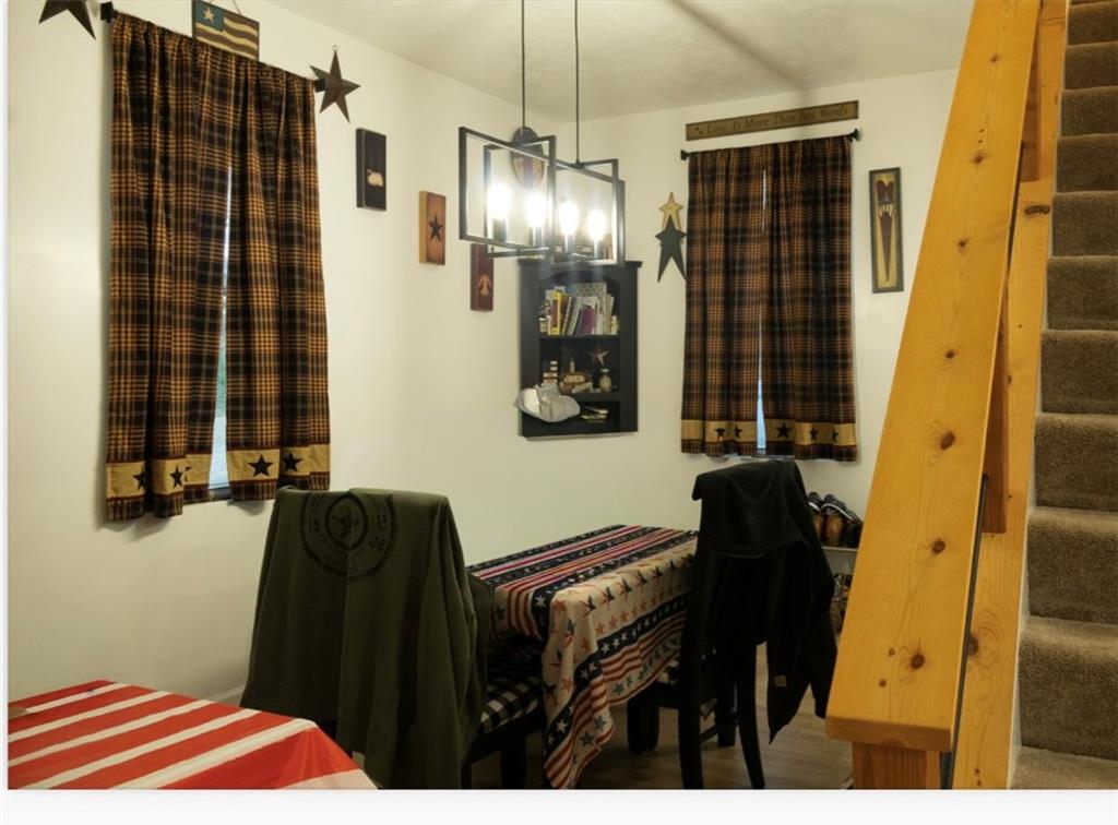 204 Pine Hill Road Kittanning, PA 16201 - Photo 10 of 23 a bedroom with a bed and a chandelier