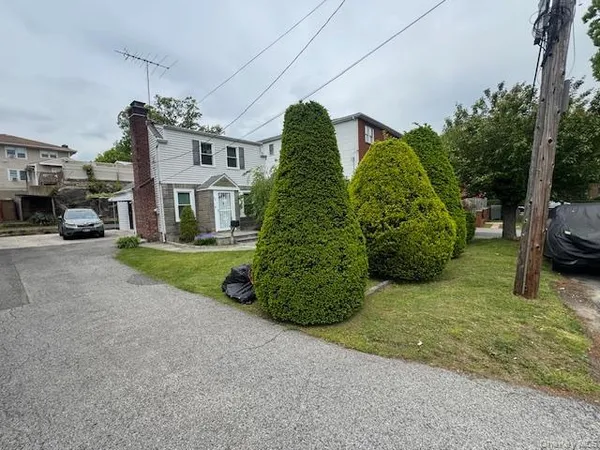 a view of a big yard with cars