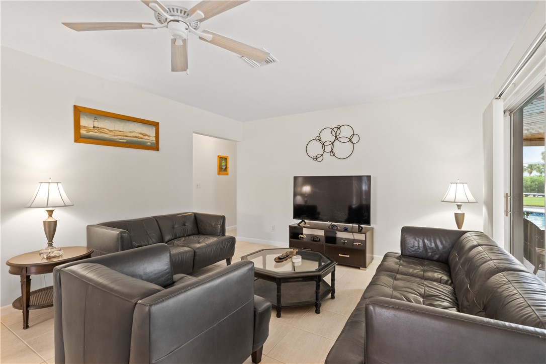618 Conn Way Vero Beach, FL 32963 - Photo 12 of 36 a living room with furniture and a flat screen tv