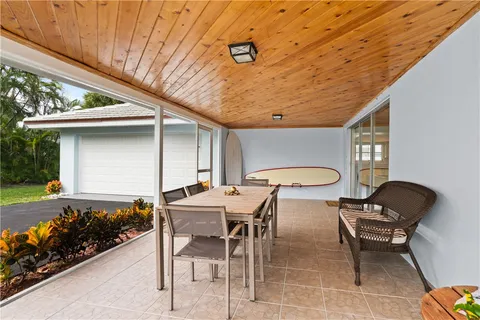 a table and chairs in front of a house