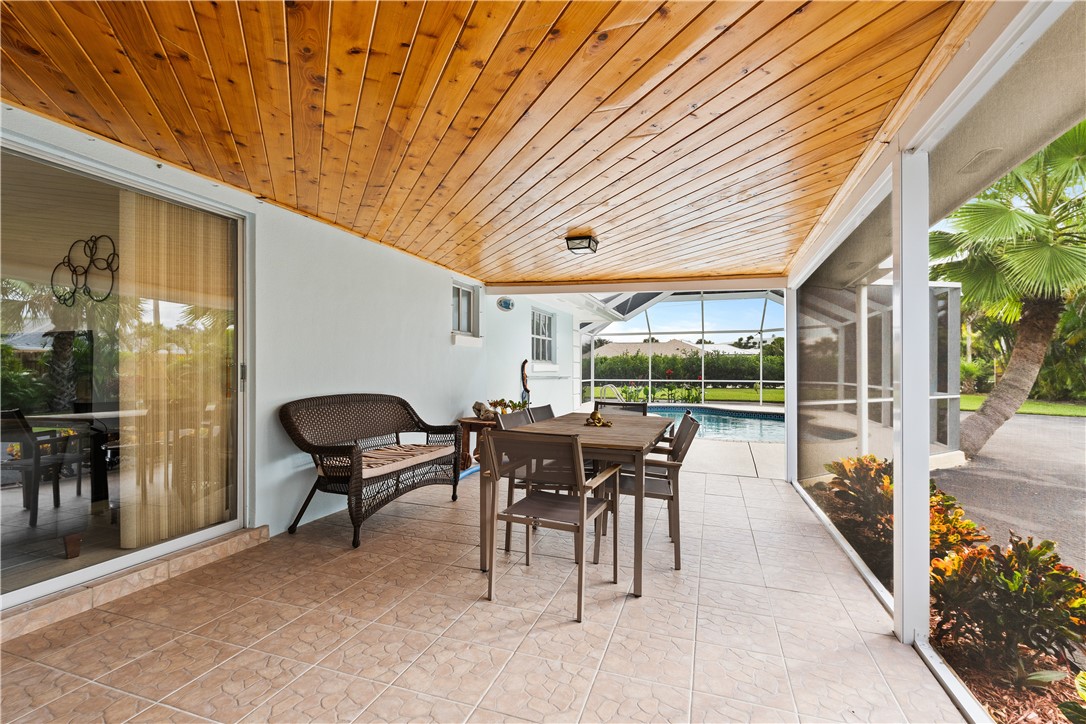 618 Conn Way Vero Beach, FL 32963 - Photo 23 of 36 a dining room with furniture and outdoor space