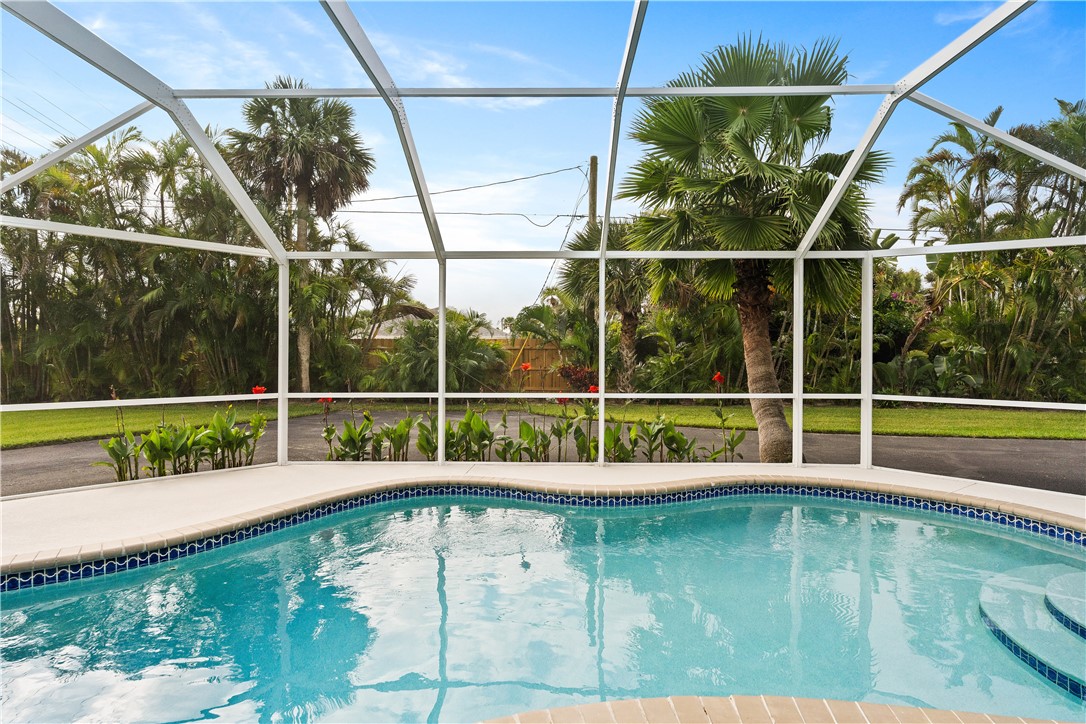 618 Conn Way Vero Beach, FL 32963 - Photo 25 of 36 a view of a swimming pool with a porch