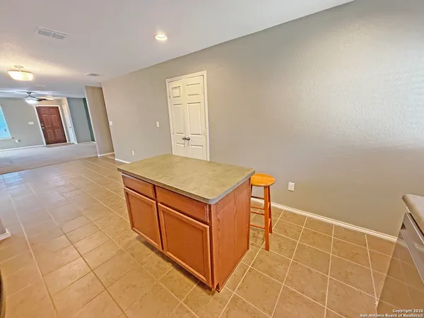 a room with a sink and cabinets