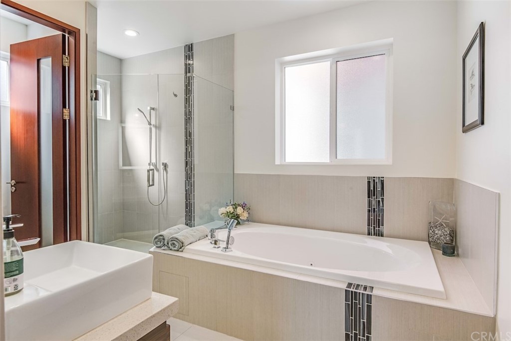 203 South Prospect Avenue, Unit A Redondo Beach, CA 90277 - Photo 19 of 39 a bathroom with a bathtub and a sink