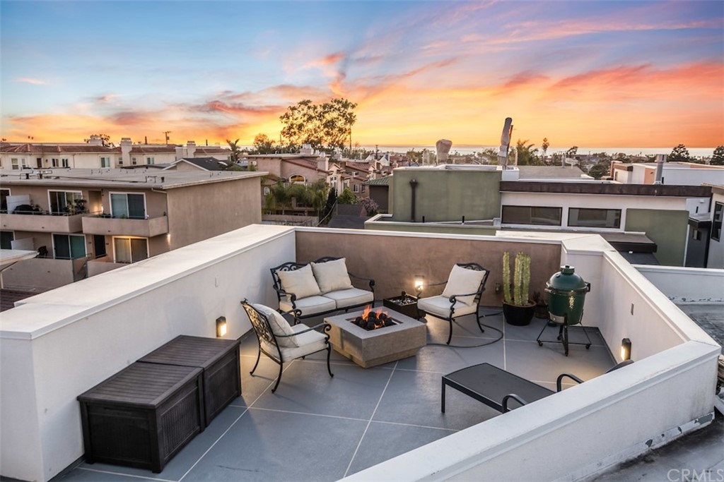203 South Prospect Avenue, Unit A Redondo Beach, CA 90277 - Photo 33 of 39 a roof deck with couches and potted plants
