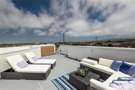 203 South Prospect Avenue, Unit A Redondo Beach, CA 90277 - Photo 36 of 39 a view of a terrace with couches and lounge chairs