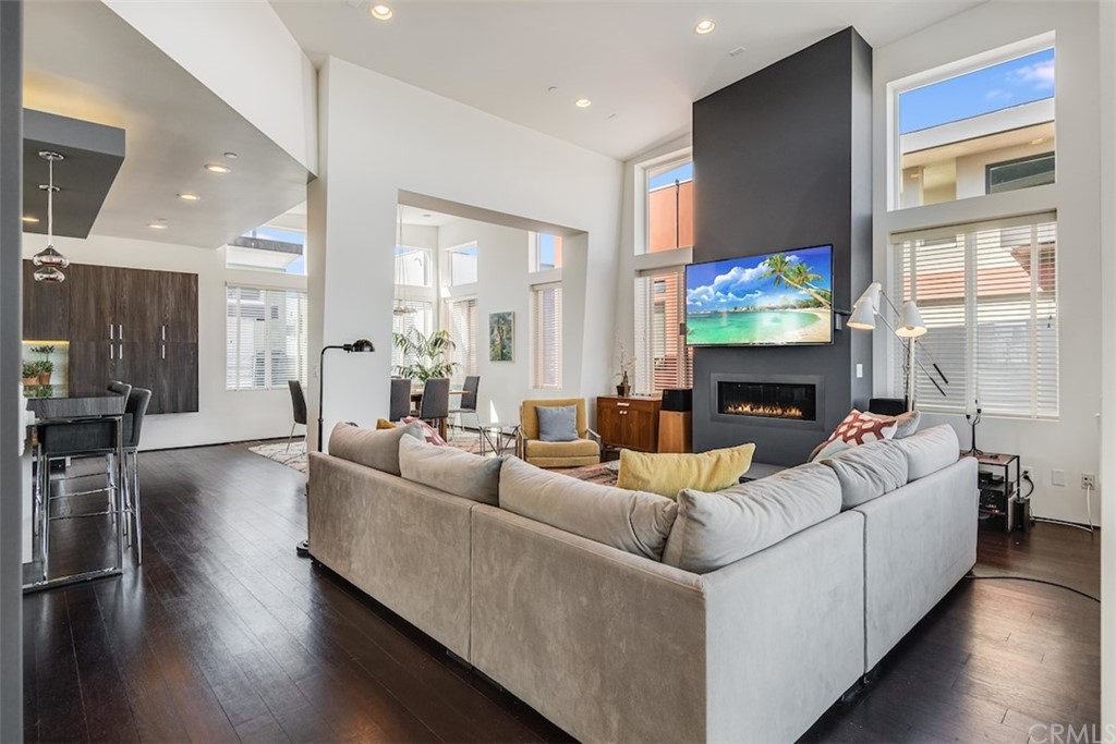 203 South Prospect Avenue, Unit A Redondo Beach, CA 90277 - Photo 5 of 39 a living room with fireplace furniture and a flat screen tv