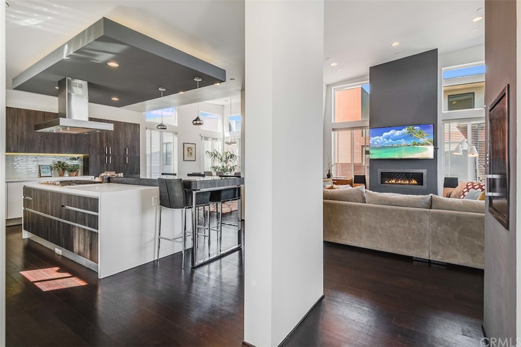 203 South Prospect Avenue, Unit A Redondo Beach, CA 90277 - Photo 7 of 39 a kitchen with stainless steel appliances kitchen island granite countertop a stove a sink and a refrigerator