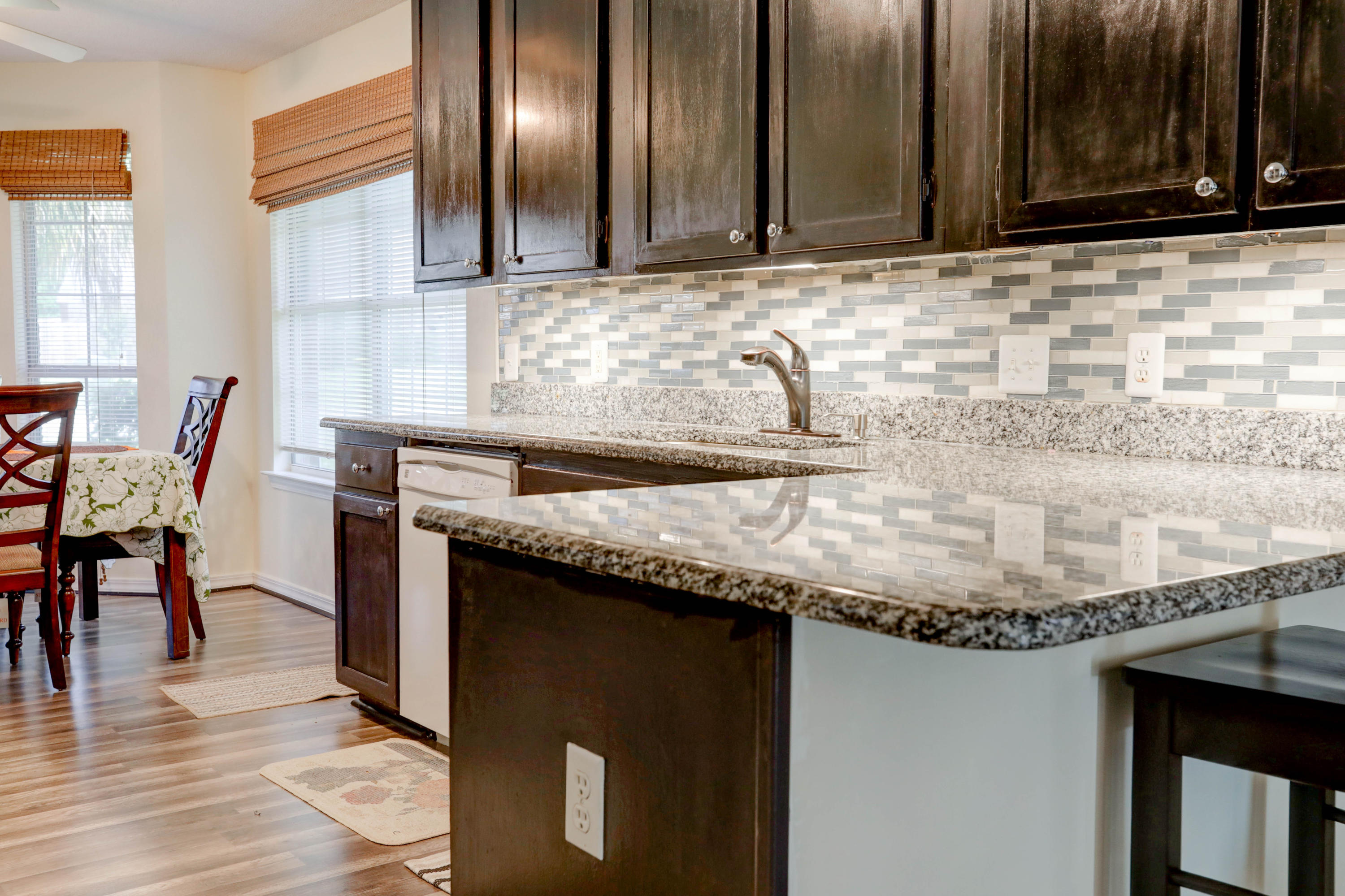 6803 Cedar Ridge Circle Milton, FL 32570 - Photo 14 of 26 a kitchen with granite countertop stainless steel appliances and wooden cabinets