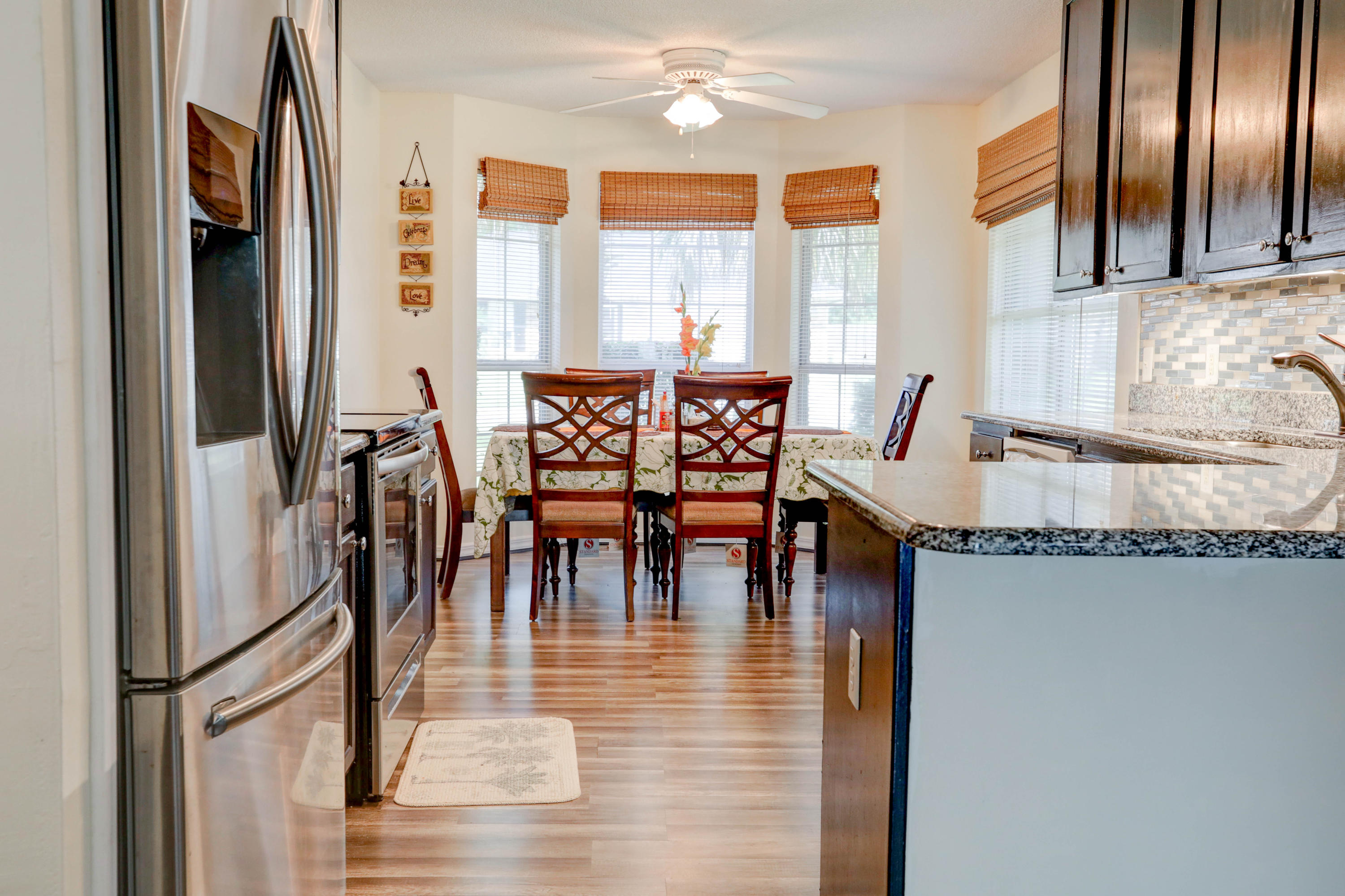 6803 Cedar Ridge Circle Milton, FL 32570 - Photo 15 of 26 a view of a dining room with furniture window and wooden floor