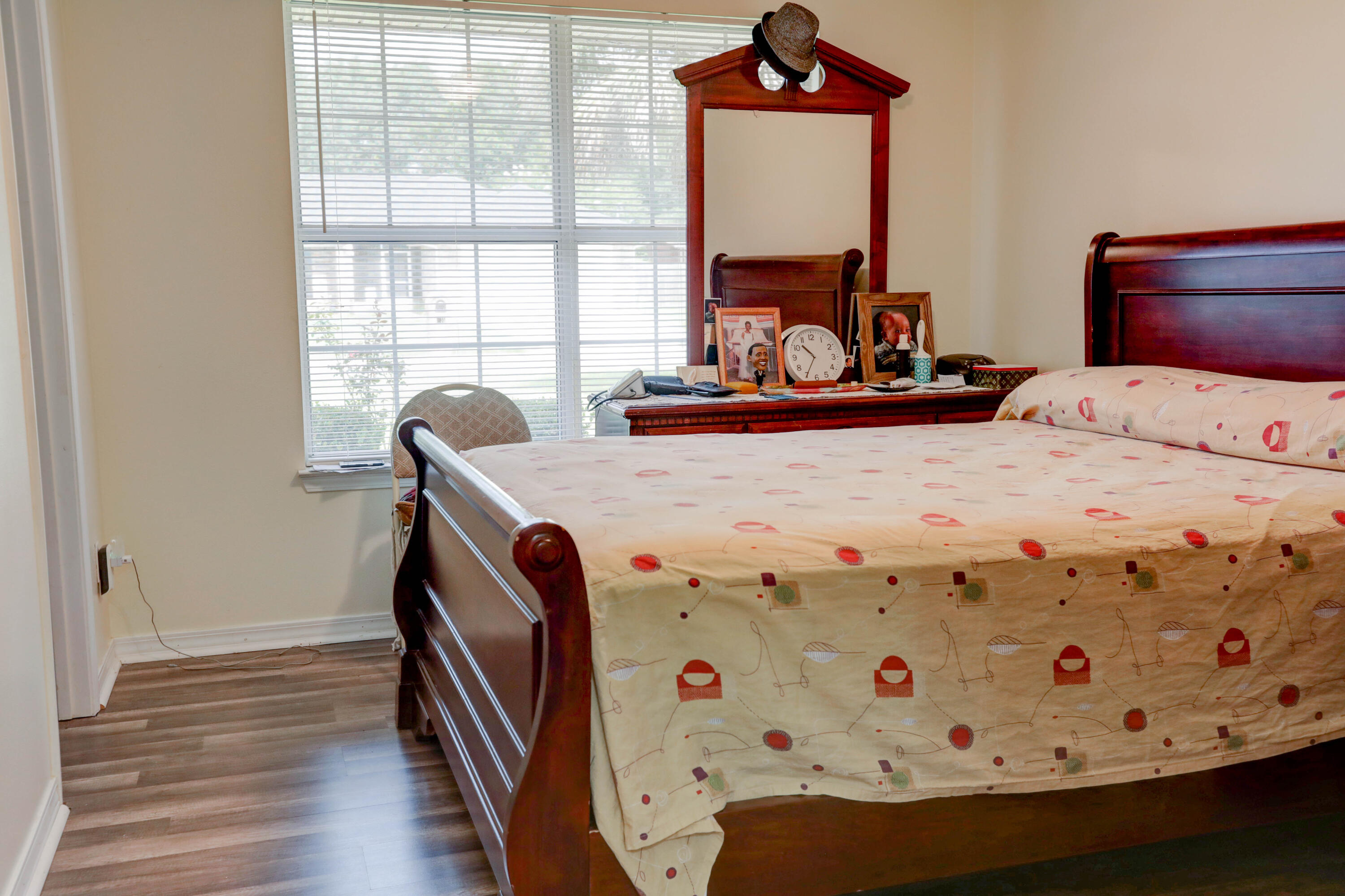 6803 Cedar Ridge Circle Milton, FL 32570 - Photo 17 of 26 a bedroom with a bed and wooden floor