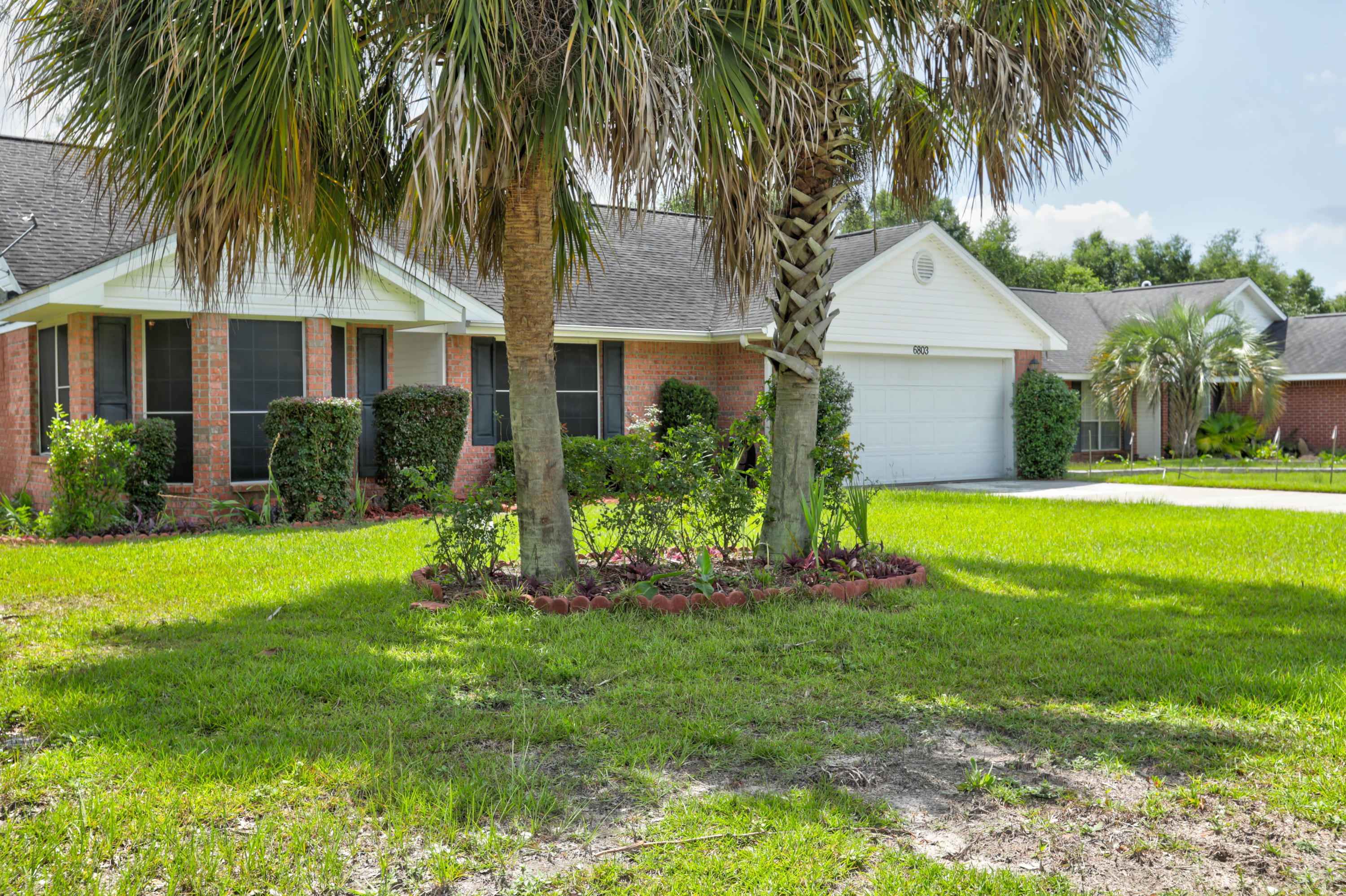 6803 Cedar Ridge Circle Milton, FL 32570 - Photo 3 of 26 a front view of house with yard and green space