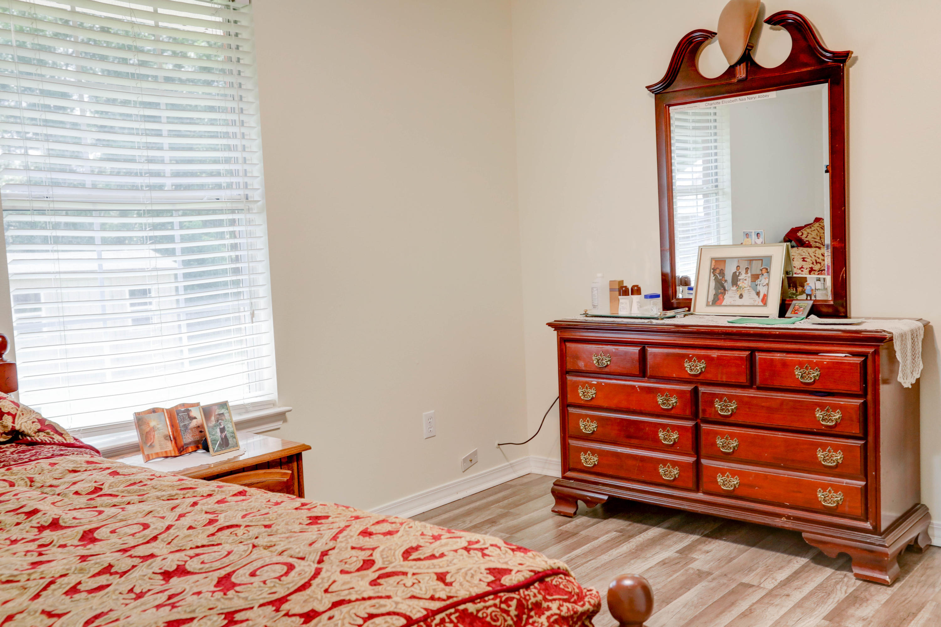6803 Cedar Ridge Circle Milton, FL 32570 - Photo 21 of 26 a bedroom with a bed and a dresser in it