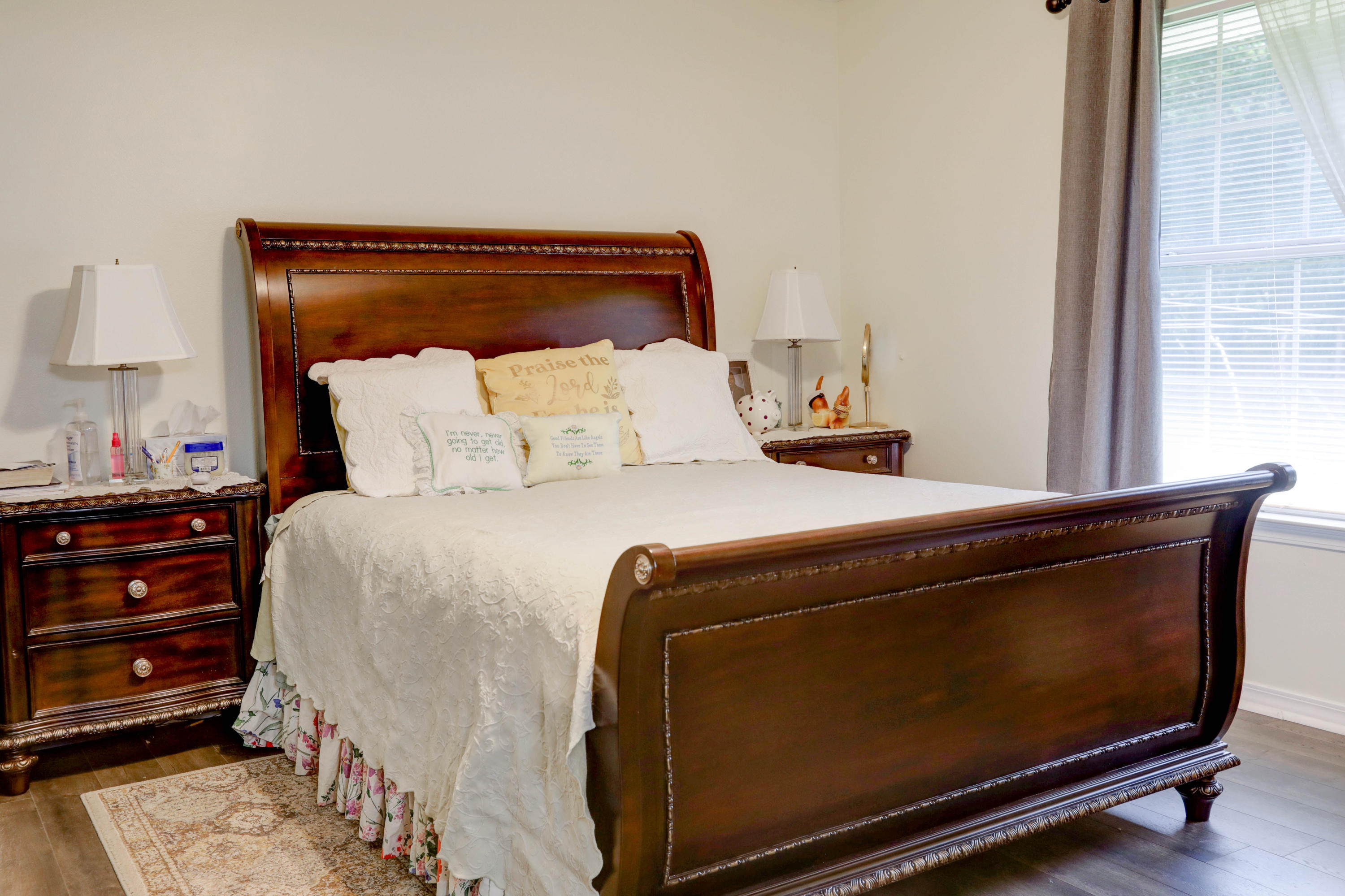6803 Cedar Ridge Circle Milton, FL 32570 - Photo 24 of 26 a bed sitting in a bedroom next to a window