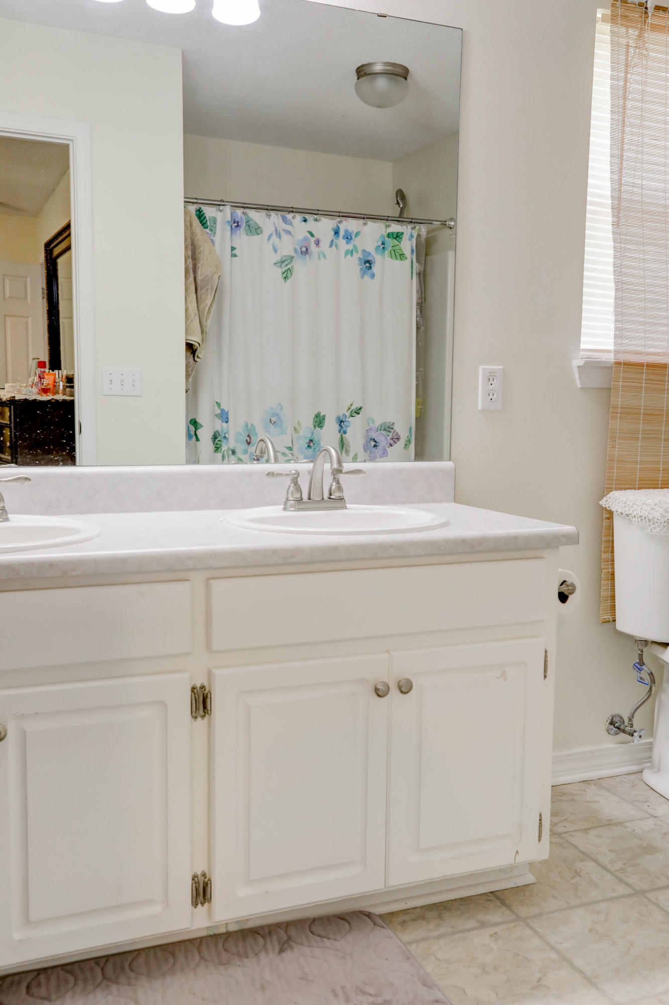 6803 Cedar Ridge Circle Milton, FL 32570 - Photo 25 of 26 a bathroom with a sink and a mirror
