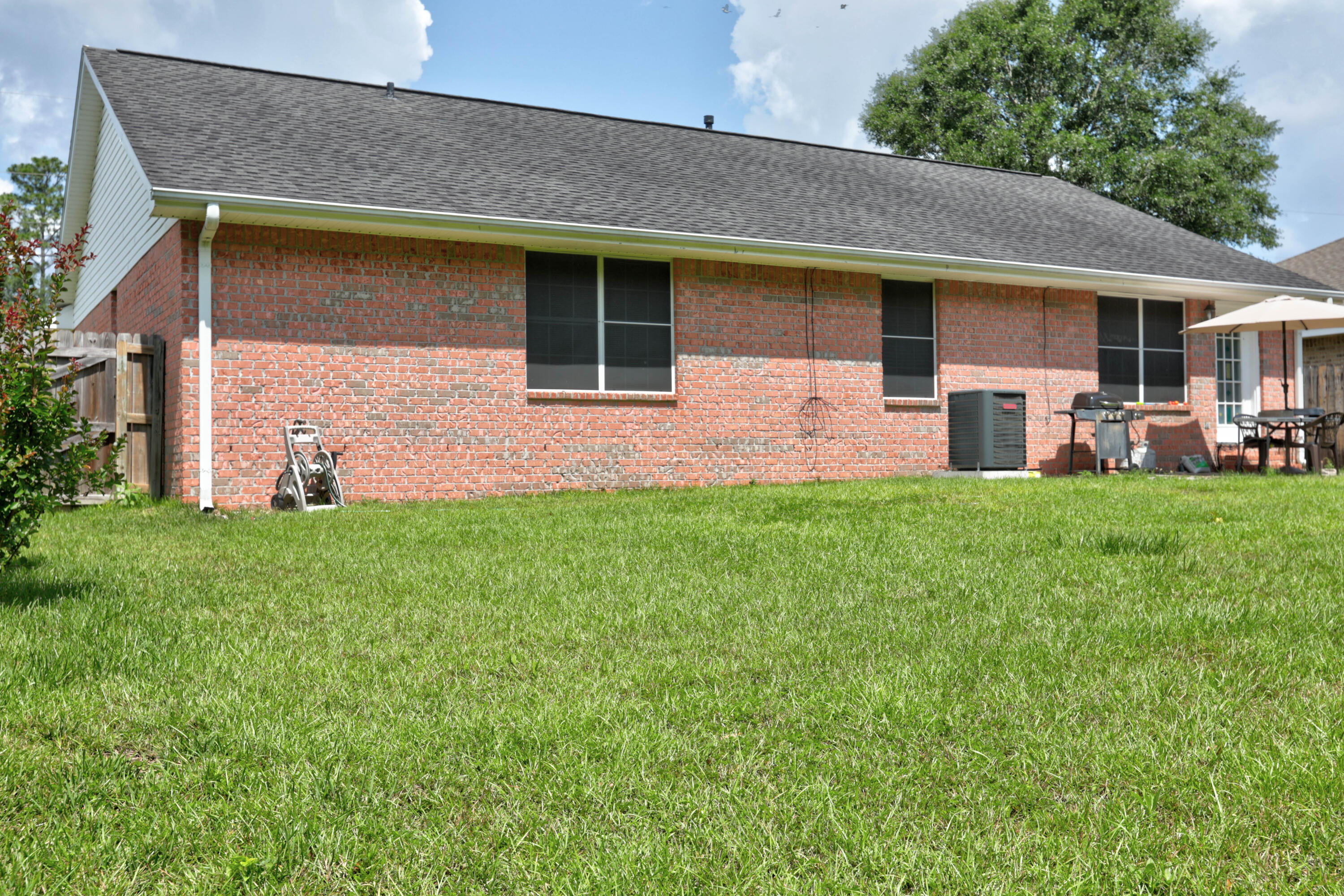 6803 Cedar Ridge Circle Milton, FL 32570 - Photo 5 of 26 a front view of house with yard