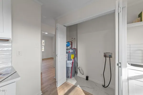 a bathroom with a granite countertop shower and a sink