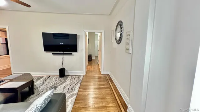 a view of a living room with a flat screen tv