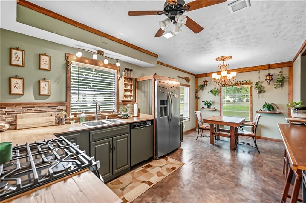 3575 Morefield Road Hermitage, PA 16148 - Photo 13 of 39 a large kitchen with a table and chairs