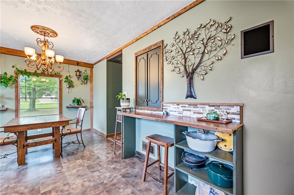 3575 Morefield Road Hermitage, PA 16148 - Photo 23 of 39 a room with a table and chairs