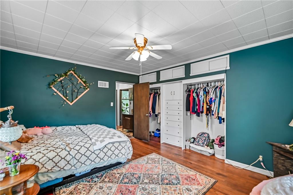 3575 Morefield Road Hermitage, PA 16148 - Photo 29 of 39 a bedroom with a bed and a chandelier