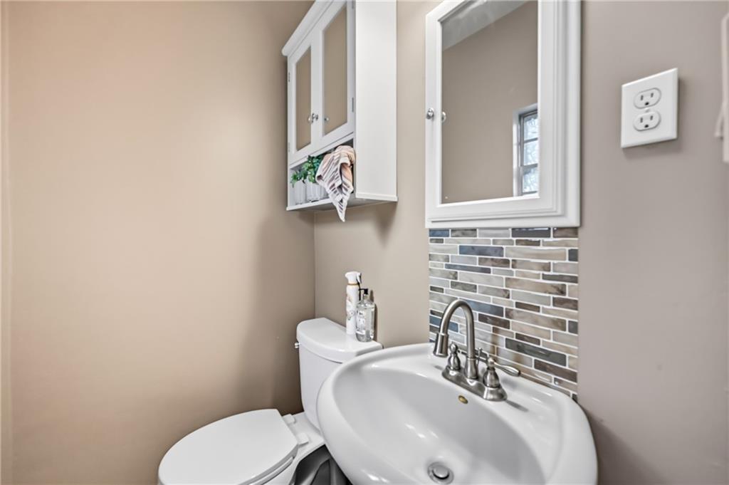 3575 Morefield Road Hermitage, PA 16148 - Photo 32 of 39 a bathroom with a toilet sink and mirror