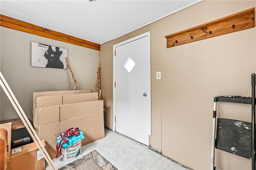 3575 Morefield Road Hermitage, PA 16148 - Photo 36 of 39 a view of a hallway with dining room and wooden floor