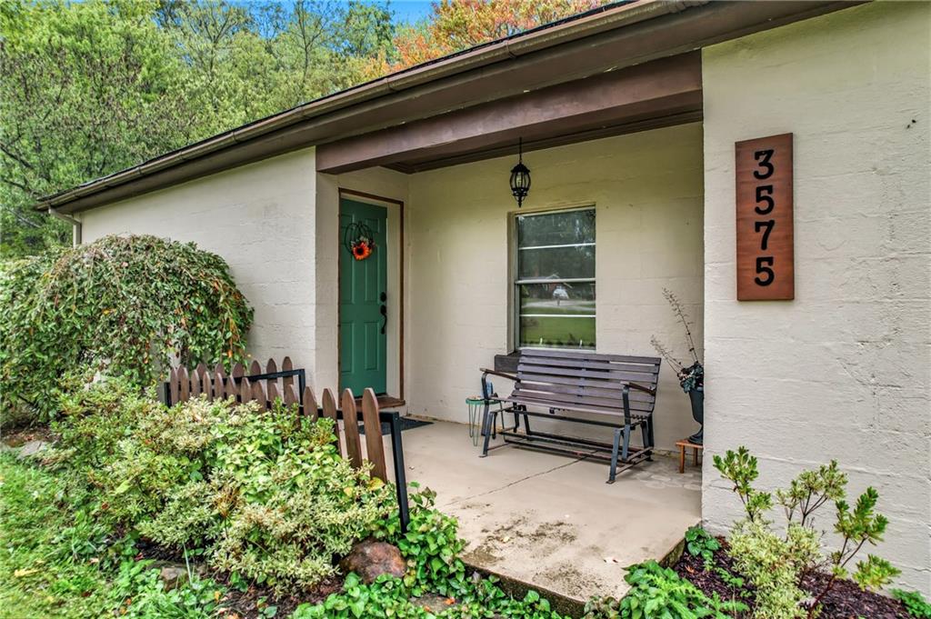 3575 Morefield Road Hermitage, PA 16148 - Photo 4 of 39 a front view of a house with a garden