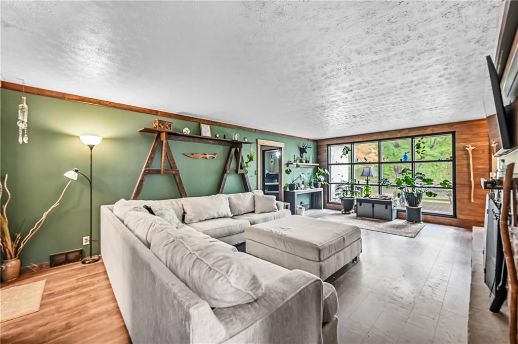 3575 Morefield Road Hermitage, PA 16148 - Photo 6 of 39 a living room with furniture and a large window