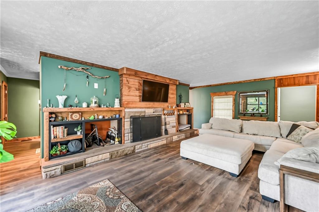 3575 Morefield Road Hermitage, PA 16148 - Photo 7 of 39 a living room with furniture and a flat screen tv