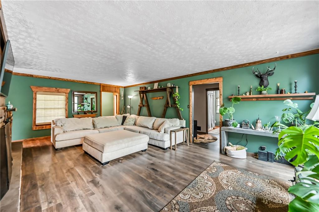 3575 Morefield Road Hermitage, PA 16148 - Photo 8 of 39 a living room with furniture and a large window