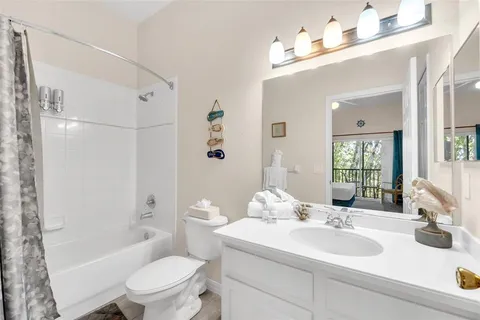 a bathroom with a sink toilet tub and shower