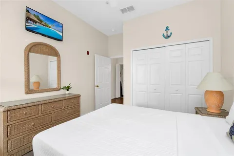 a bedroom with a bed and a dresser