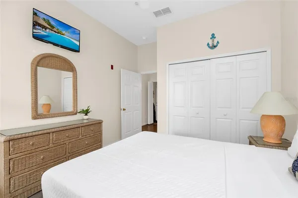 a bedroom with a bed and a dresser