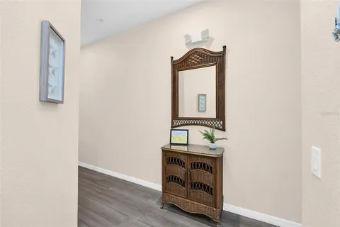 a room with a mirror and a wooden floor