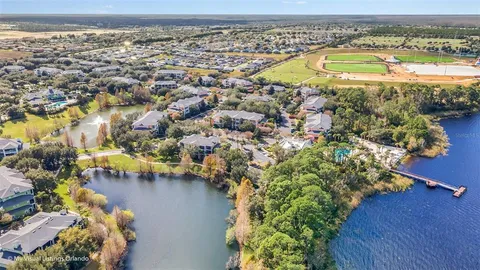 an aerial view of a house with a lake view