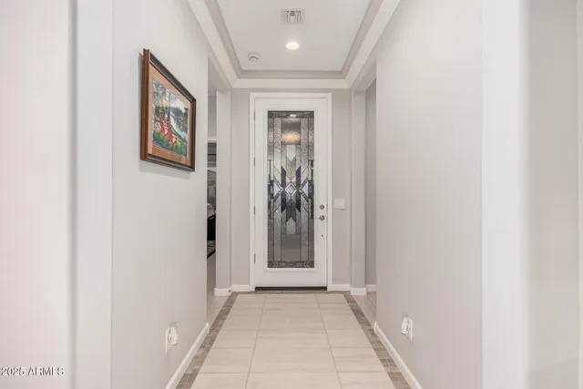 a kitchen with stainless steel appliances granite countertop a refrigerator a stove a sink a dining table and chairs