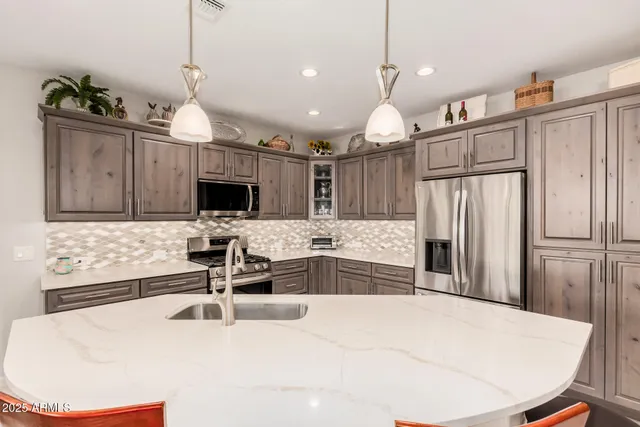 a bedroom with a bed and a lamp on table